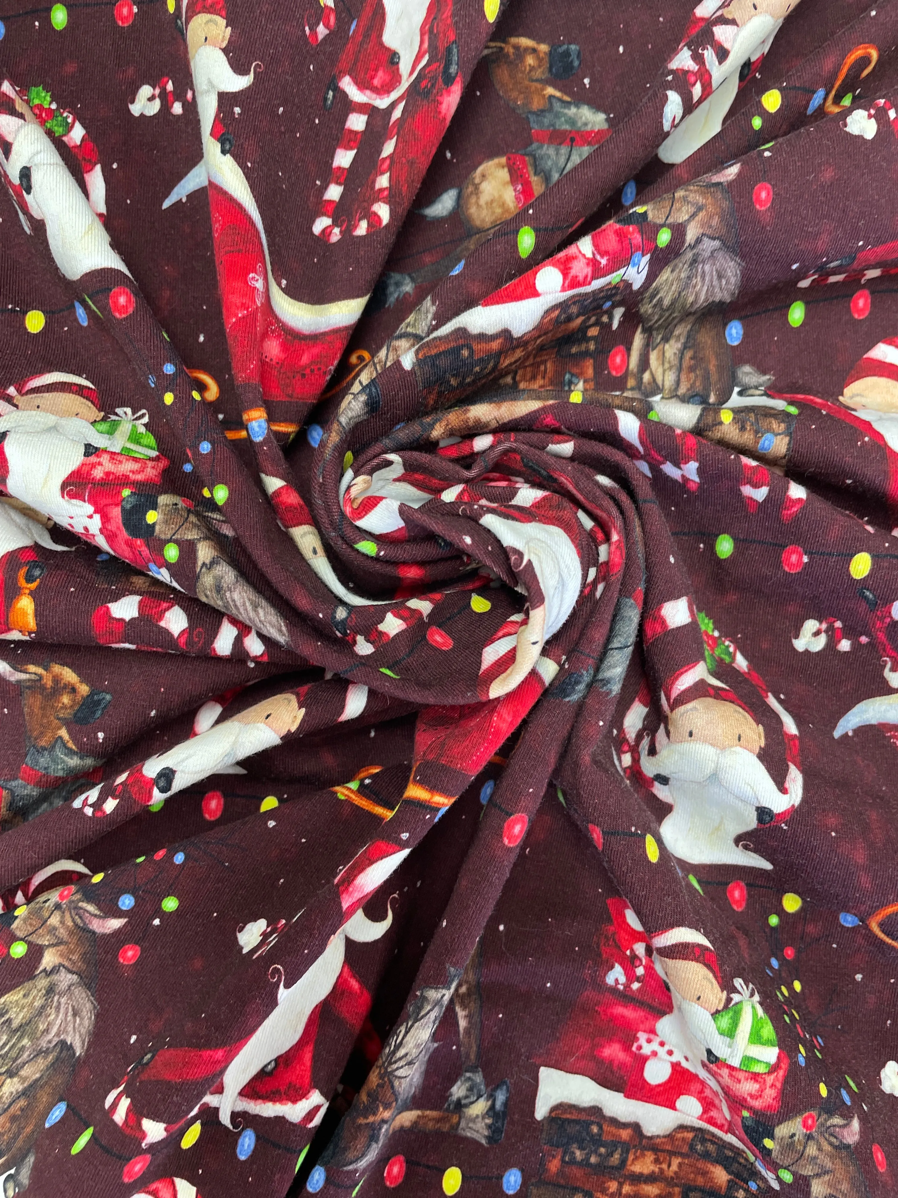 SALE 3/4 YD Cotton/Spandex Remnant - Maroon with Whimsical Santas & Reindeer